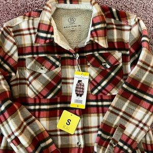 Women’s Sage fleece lined jacket. Red plaid size small, front and side pockets
